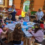Children sat around a table taking part in Supersleuth ctivies