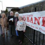 Volunteers standing outside Church Angels Food Bank, Port Glasgow