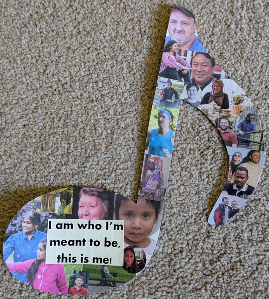 Cutout musical note with photographs of people's face stuck on, and the text I am who I'm meant to be, this is me!