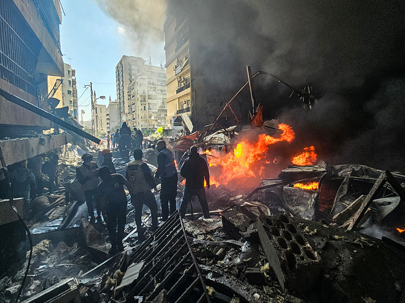 First responders stand amid rubble at the site of an Israeli airstrike in Beirut's Corniche al-Mazraa neighbourhood on April 8, 2026. Israel launched a series of strikes in Beirut on April 8, causing panic among residents in the most violent attack on the capital since the start of the war with Hezbollah. The Israeli military said it carried out its "largest coordinated strike across Lebanon". Israel has insisted the two-week truce in its war with Iran does not apply to Lebanon. (Photo by AFP via Getty Images)